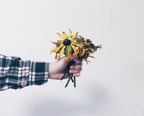 hand holding flowers