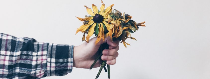 hand holding flowers