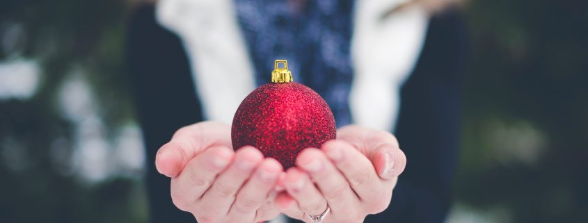 Hands giving ornament