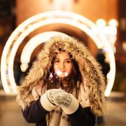 woman holding sparkler for stocks