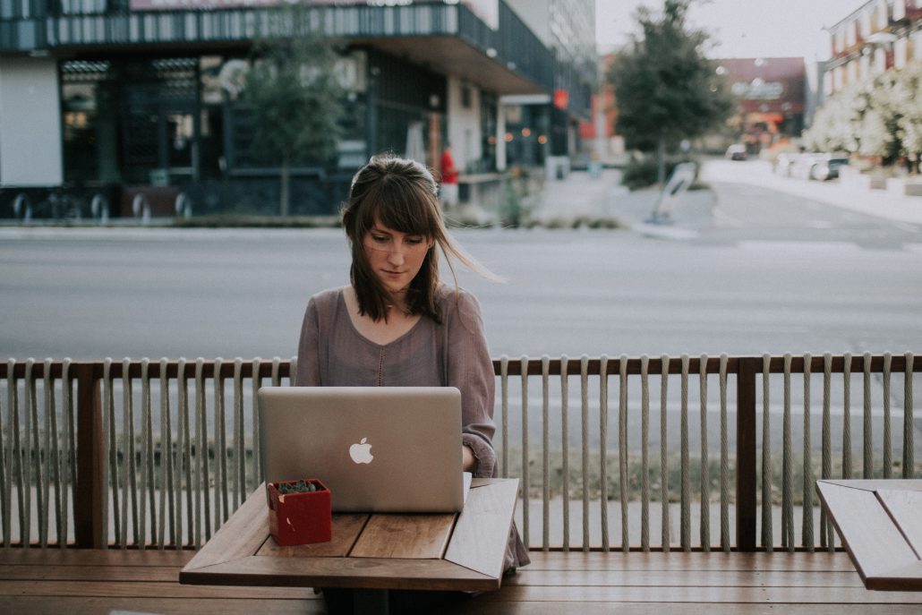 woman on laptop on patio