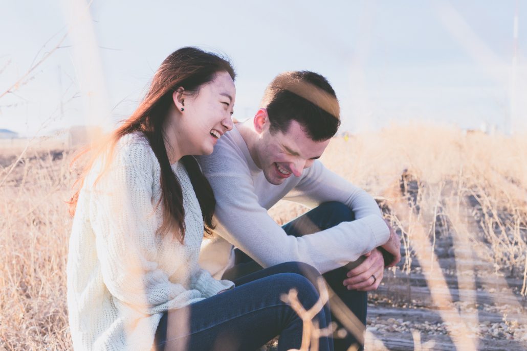 two people talking on the beach