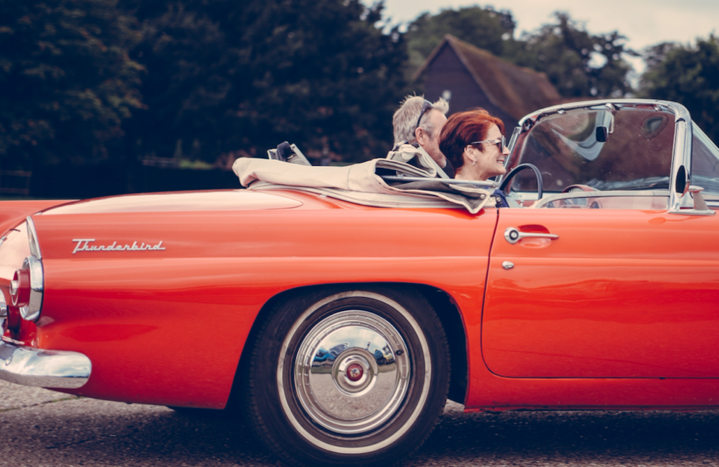 couple in red car