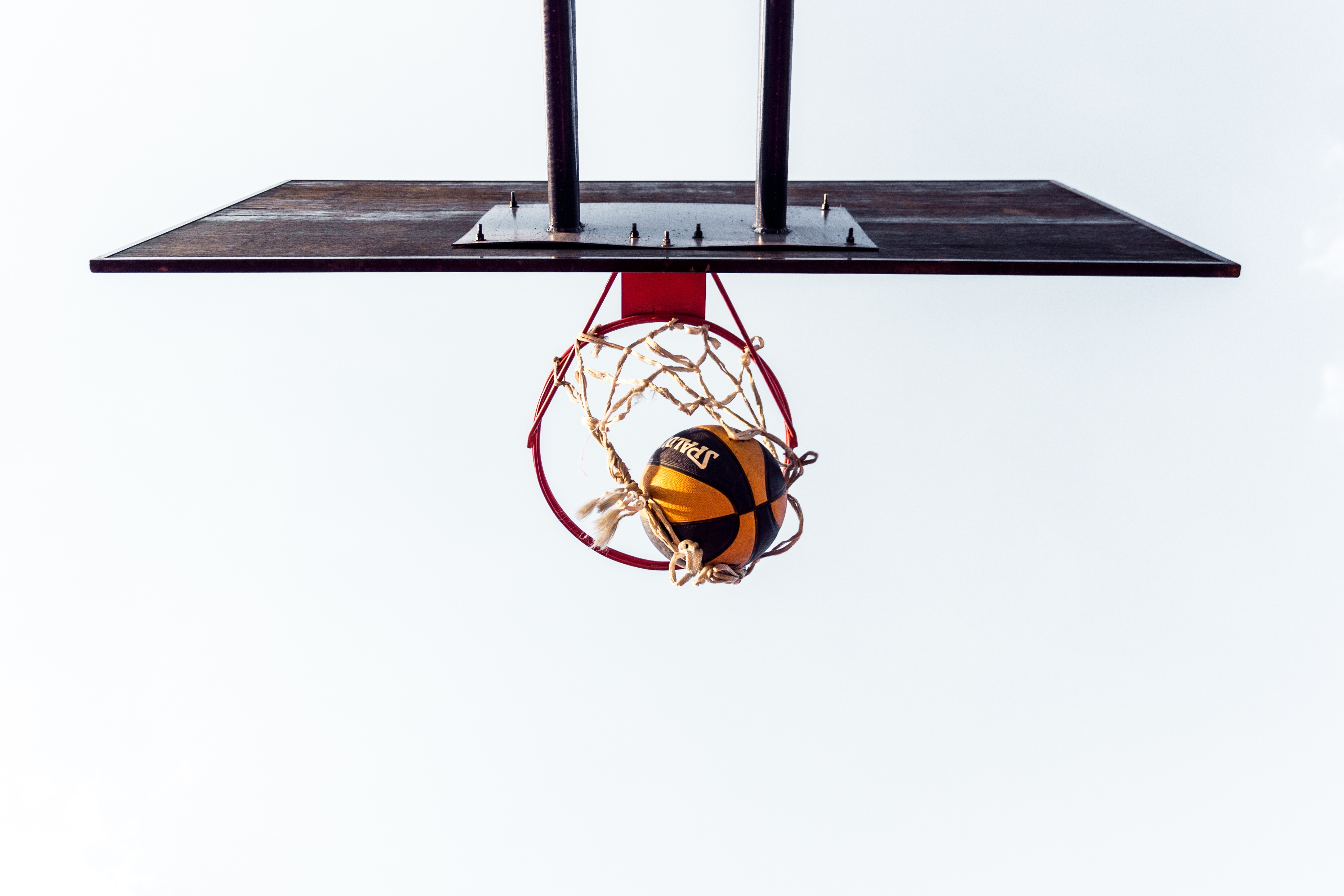 basketball court with ball in hoop