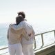 Couple overlooking ocean on boat