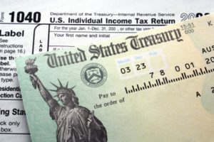US Treasury note on top of IRS forms