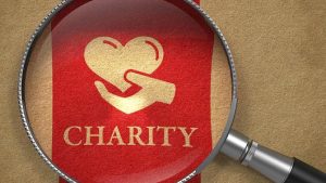 Magnifying glass over charity