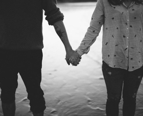 Young couple holding hands