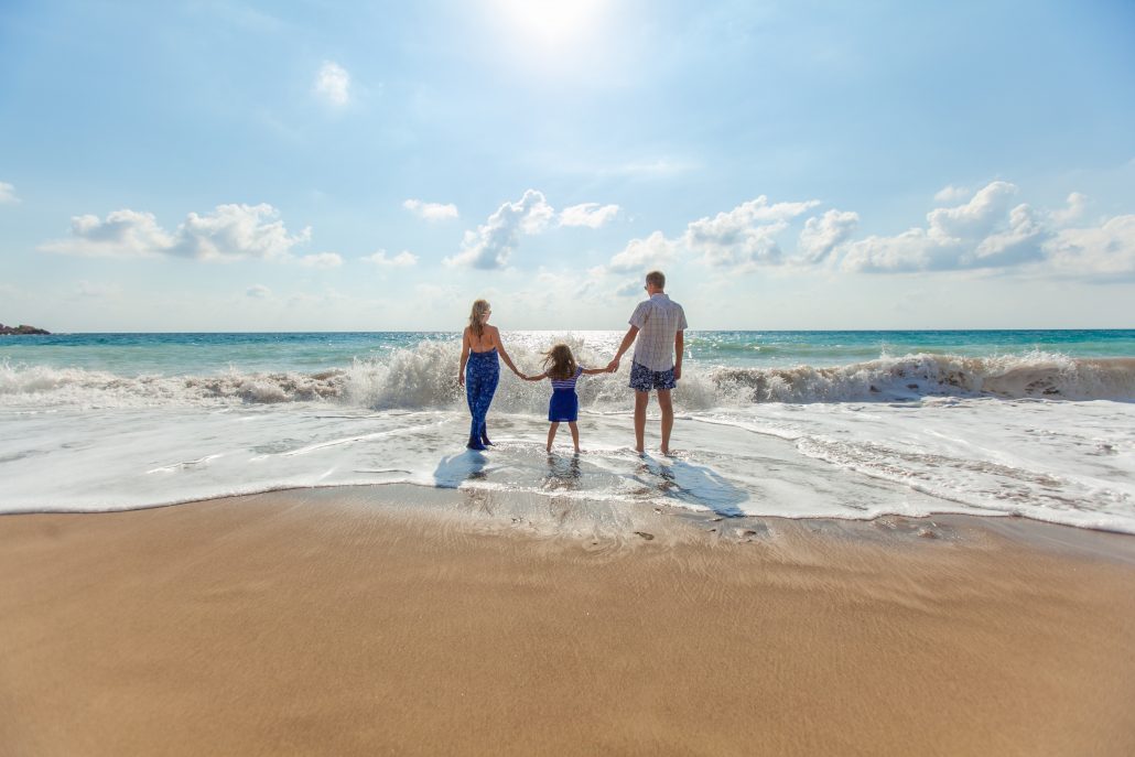 couple with child at beach