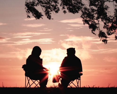 Two people looking at sunset