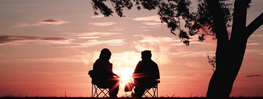 Two people looking at sunset
