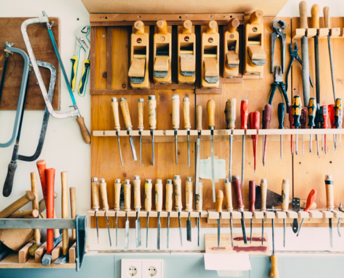 hammers and tools hanging in garage