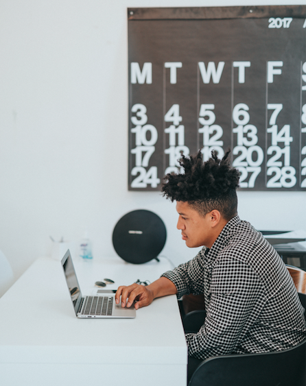 man typing on computer 