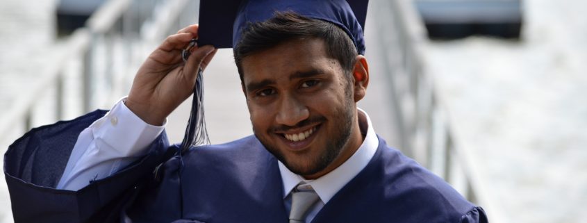 College student in graduation robes