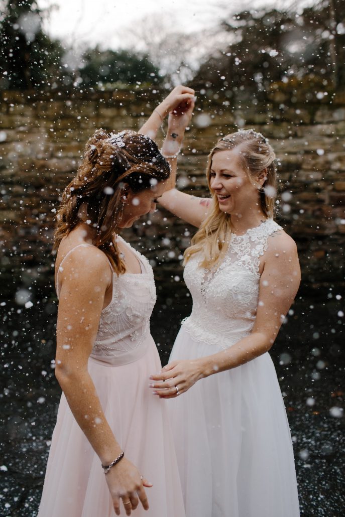 Two brides in white wedding dresses