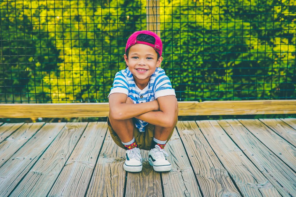 Child smiling on bridge