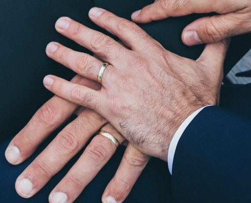 hands of 2 grooms