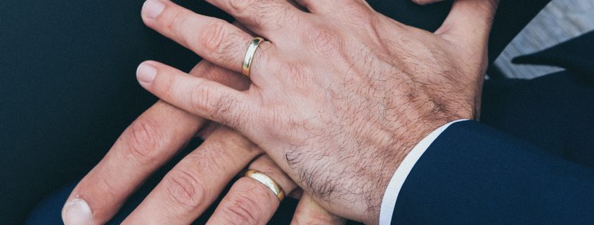 hands of 2 grooms