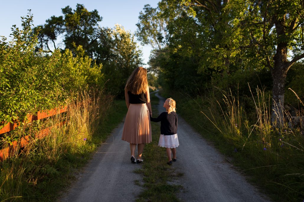 mom and daughter holding hands