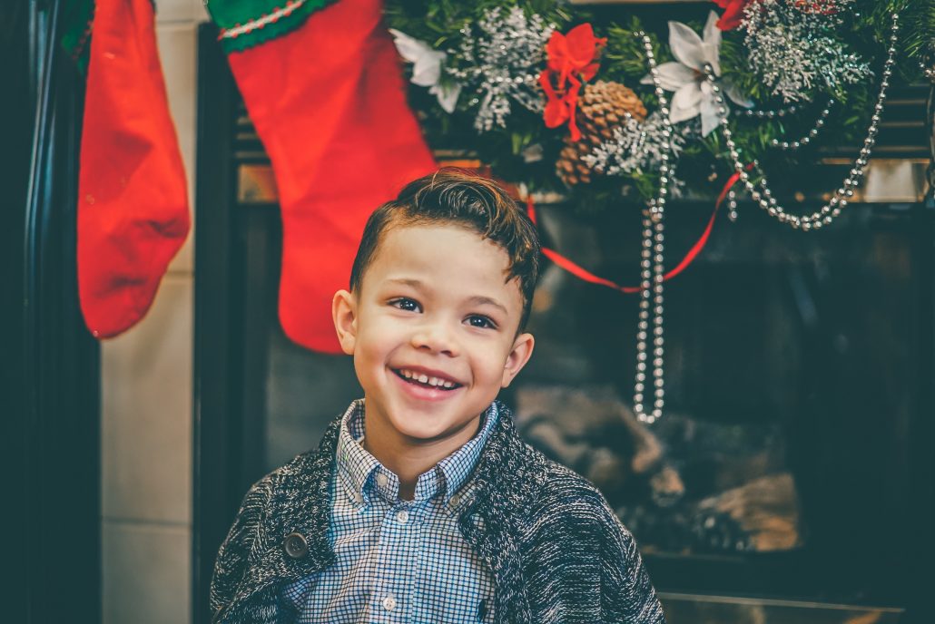 child in front of stocking