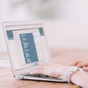 hands typing on computer