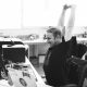 man stretching at desk