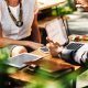 discussion over table with laptop