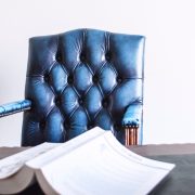 Conflict of Interest chair with book on table