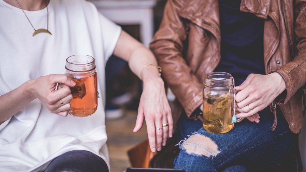 two people drinking tea