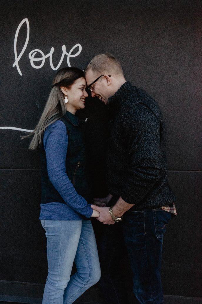 couple in love with writing on wall