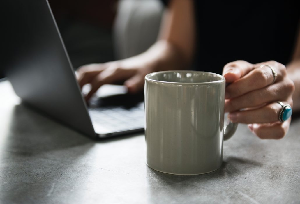 coffee mug and computer