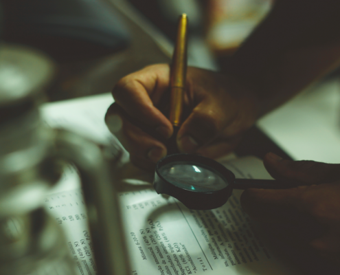 magnifying glass over book