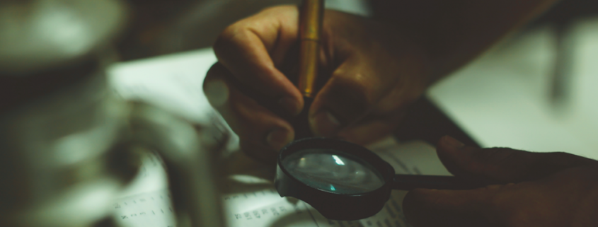 magnifying glass over book