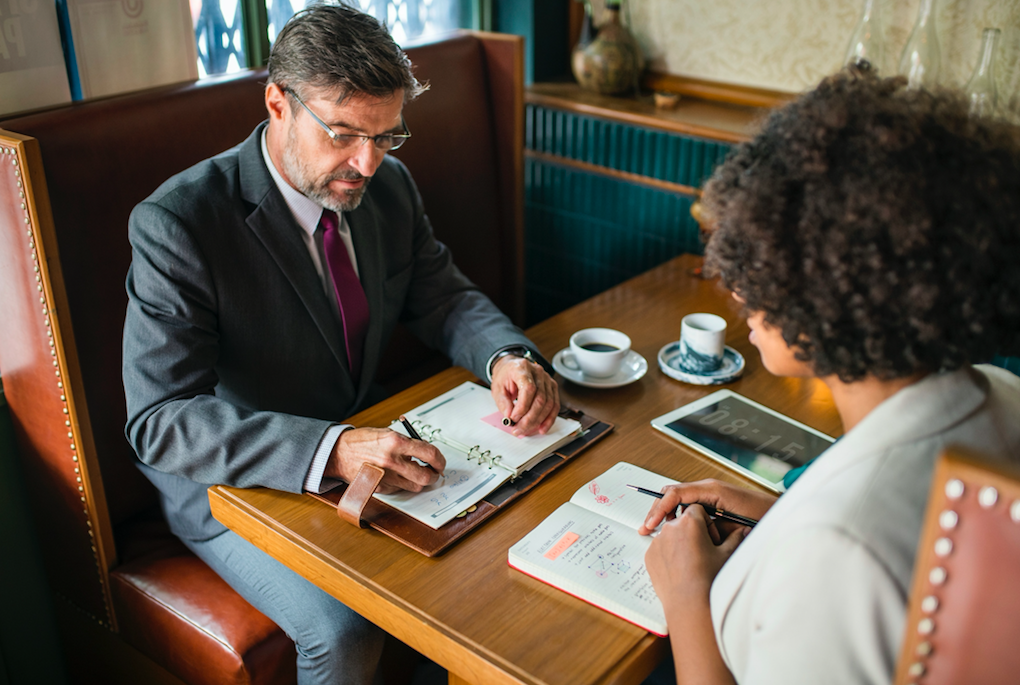 two people sitting at table