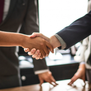 shaking hands over interview table