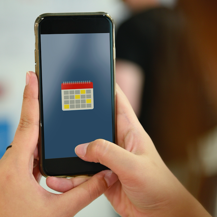 hands on phone with calendar app