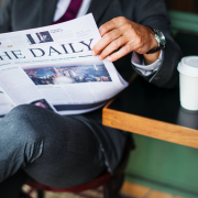 man reading newspaper