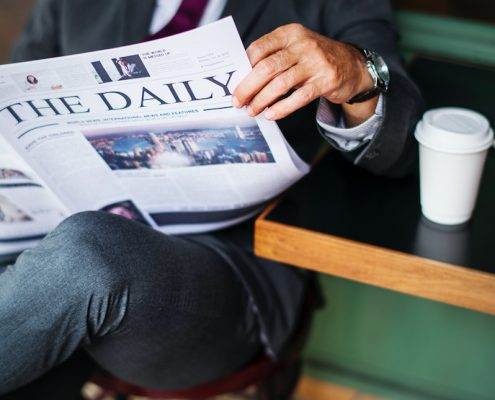 man reading newspaper