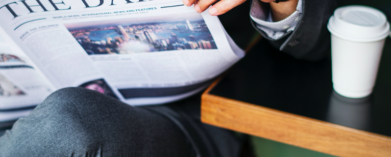 man reading newspaper