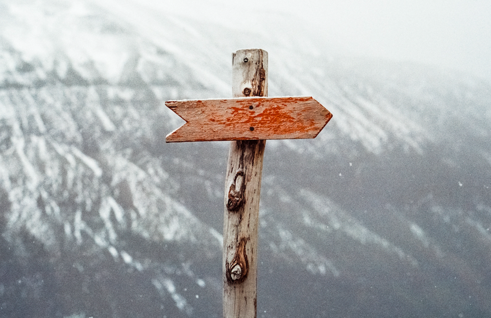 direction sign on a mountain