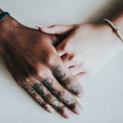 two people holding hands on white background