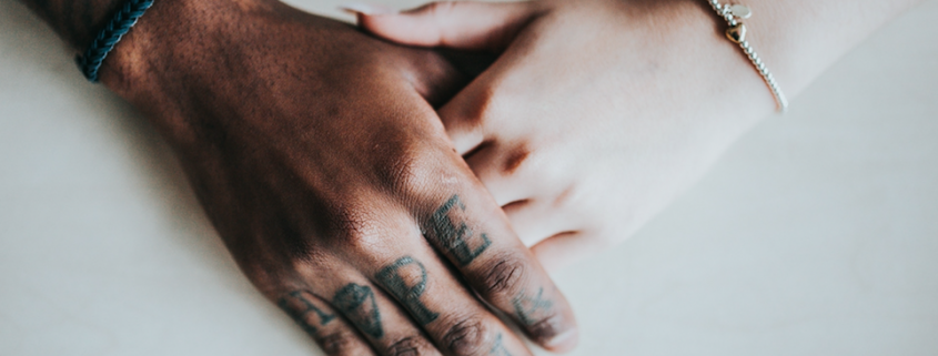 two people holding hands on white background