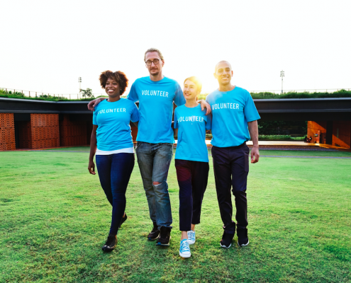 volunteers walking on grass