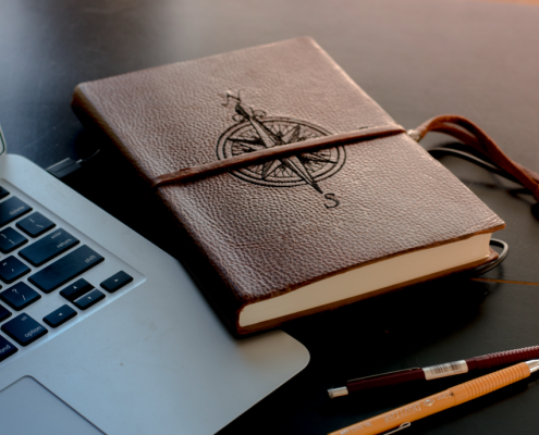 compass journal near macbook