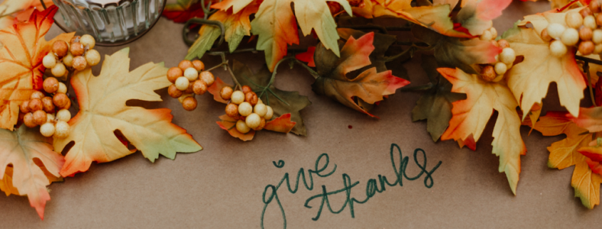 give thanks table with autumn leaves