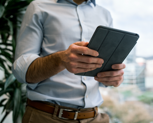 man reading on tablet