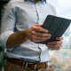 man reading on tablet