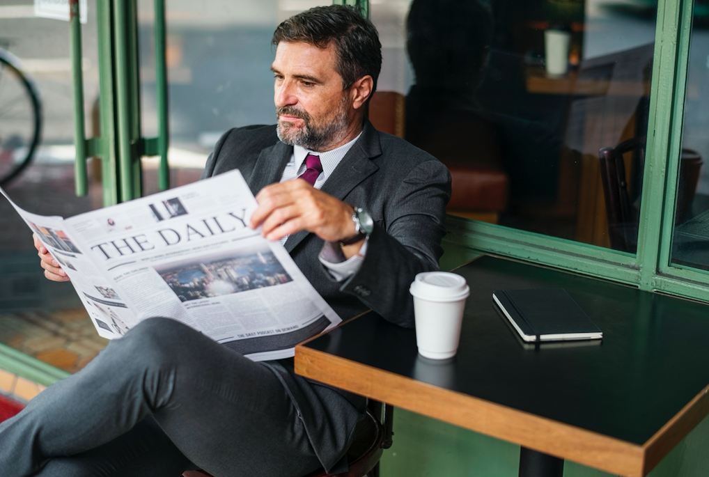 man reading paper