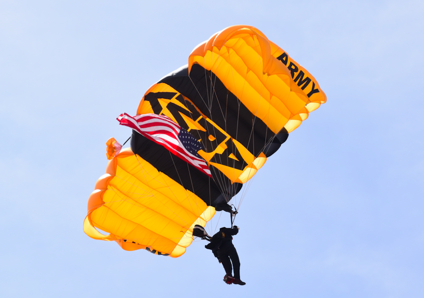man with army parachute