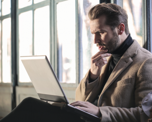 man questioning computer
